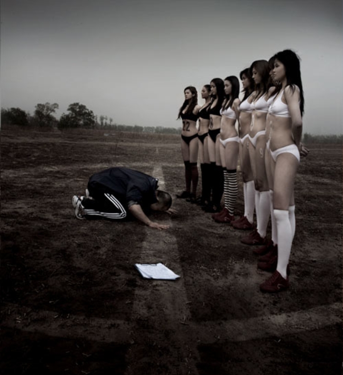 asian-coach-kneel-before-women-soccer-team.jpg